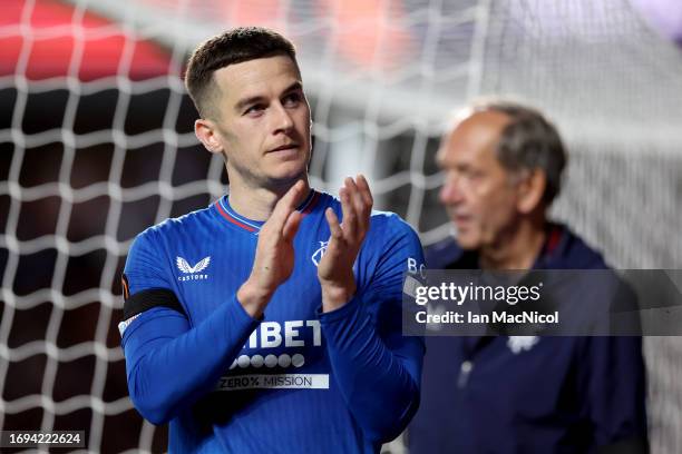 Tom Lawrence of Rangers applauds the fans whilst leaving the pitch after suffering an injury during the UEFA Europa League 2023/24 match between...