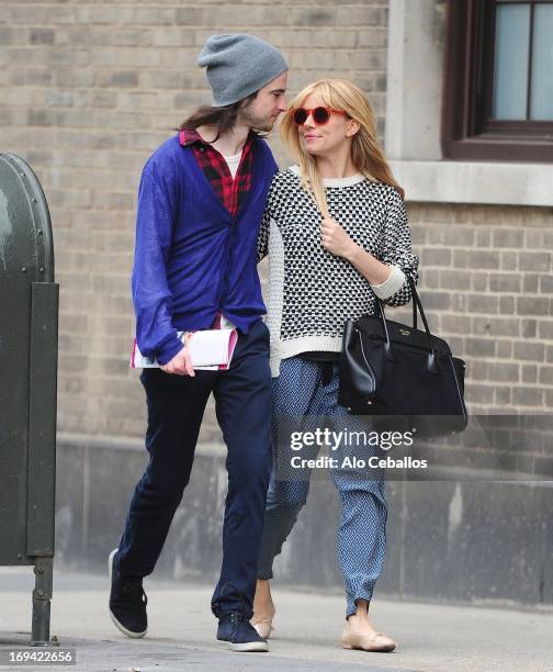 Tom Sturridge and Sienna Miller are seen in the West Village on May 24, 2013 in New York City.