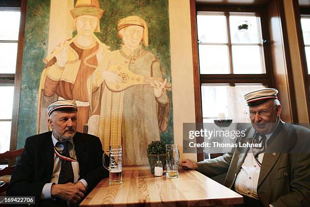 Members of German traditional university fraternities, in German called Burschenschaften, drink beer in a pub before a ceremony at the Wartburg...