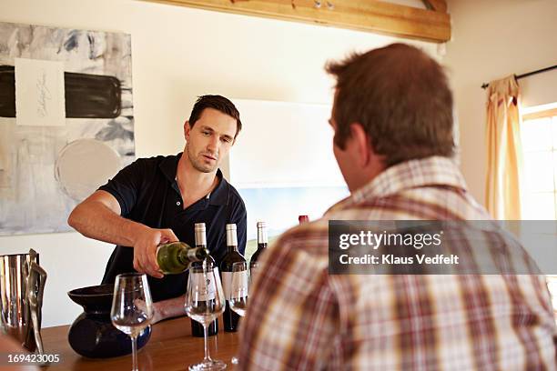 sommelier pouring wine at tasting - sommelier stock pictures, royalty-free photos & images
