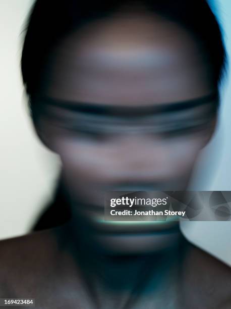 blured image of female shaking head - editorial stock-fotos und bilder