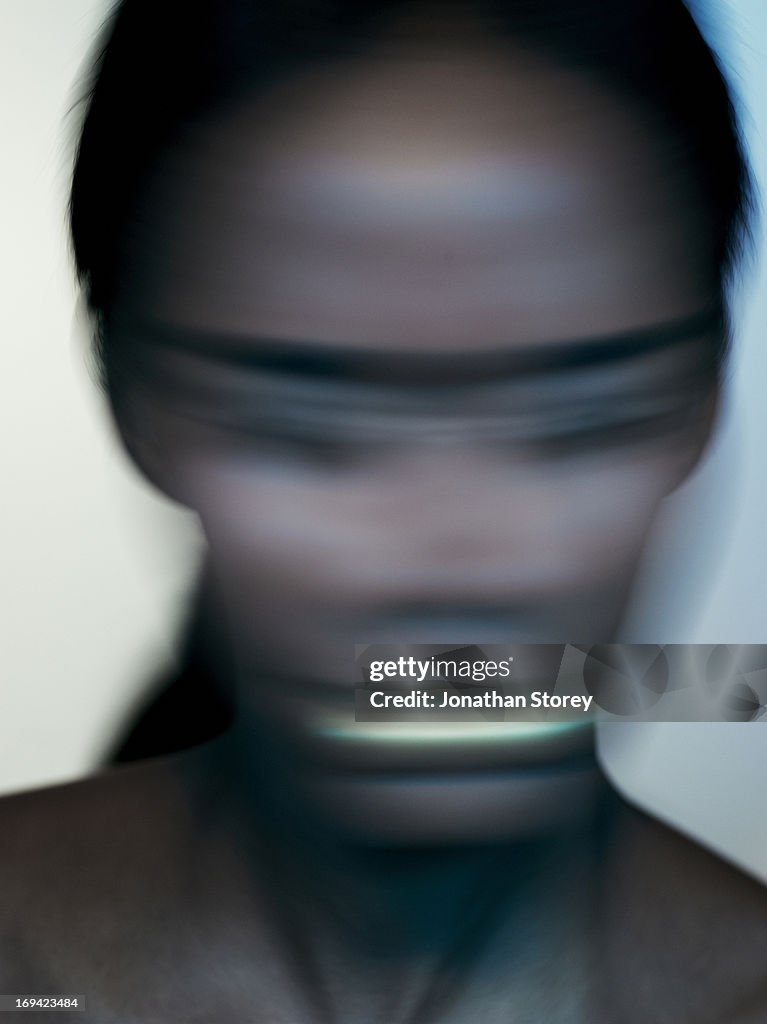 Blured image of female shaking head