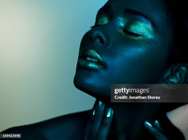 dark image of black female closed eyes - editorial woman stock pictures, royalty-free photos & images