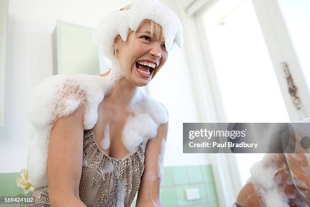 couple covered with soap suds in bathroom - messy boyfriend stock pictures, royalty-free photos & images