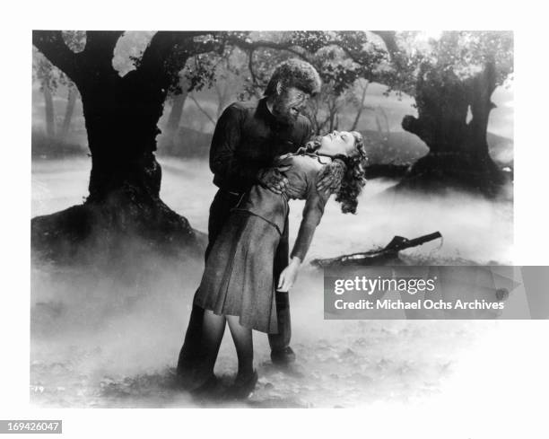 Lon Chaney Jr about to take a bite out of Evelyn Ankers in a scene from the film 'The Wolf Man', 1941.