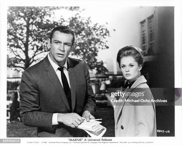 Sean Connery and Tippi Hedren looking back in a scene from the film 'Marnie', 1964.