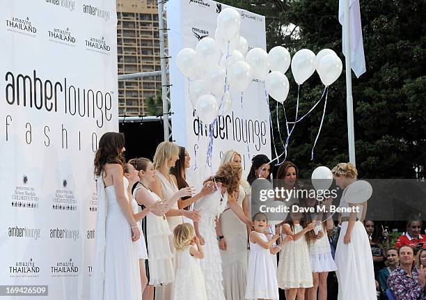 Models including Emilia Pikkarainen, Laura Jordan, Catherine Hyde, Jennifer Beck, Sonia Irvine, Natalie Pinkham and Jessica Michibata attend Amber...