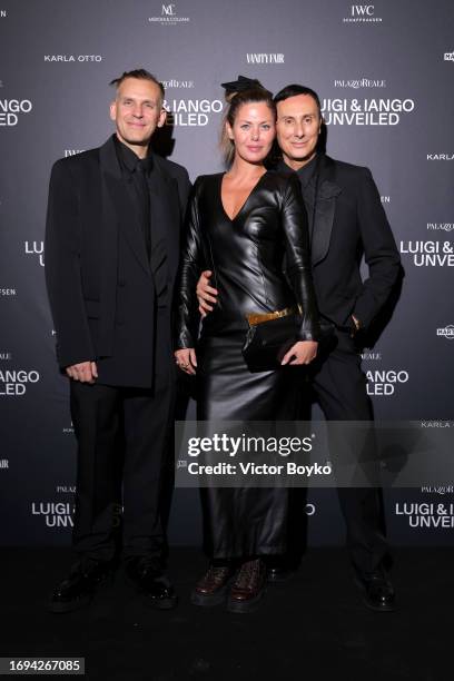 Iango Henzi, Sara Battaglia and Luigi Murenu attend the photocall for the Luigi & Iango Unveiled Exhibition Opening at Palazzo Reale on September 21,...