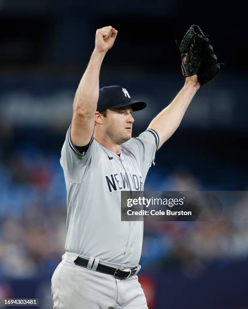 Gerrit Cole of the New York Yankees celebrates pitching a complete game shutout against the Toronto Blue Jays at Rogers Centre on September 27, 2023...