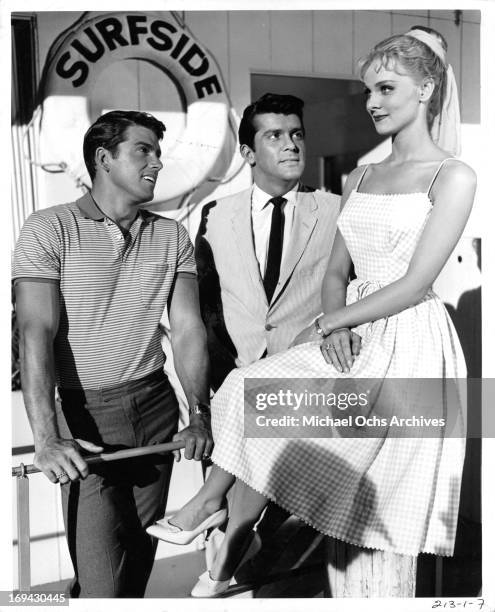 Van Williams and Lee Patterson admiring Diane McBain in a scene from the television series 'Surfside 6', 1960.