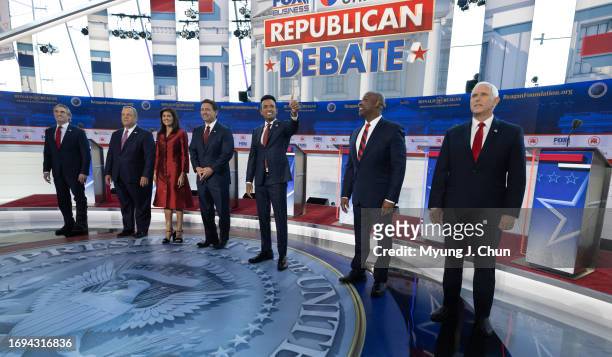 Presidential candidates Doug Burgum, left, Chris Christie, Nikki Haley, Ron Desantis, Vivek Ramaswamy, Tim Scott and Mike Pence meet the crowd before...