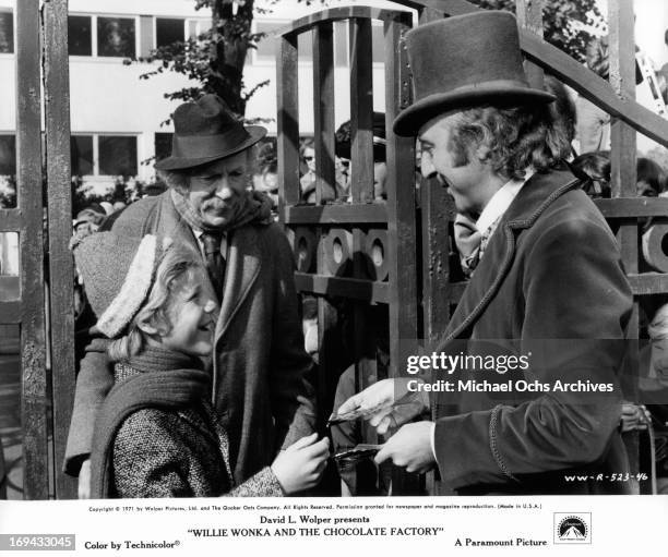 Peter Ostrum and Jack Albertson are greeted at the factory gate by Gene Wilder in a scene from the film 'Willy Wonka & the Chocolate Factory',...