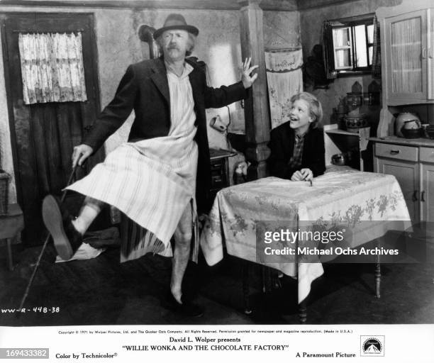 Jack Albertson dancing in front of Peter Ostrum in a scene from the film 'Willy Wonka & the Chocolate Factory', 1971.