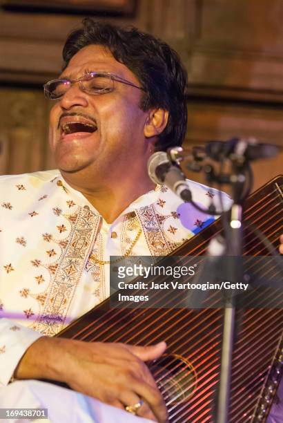 Indian vocalist Mashkoor Ali Khan of the Kirana gharana plays a swarmandal during a performance during the 7th Annual Chhandayan All Night Concert of...