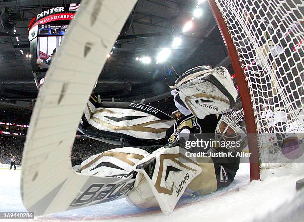 Tomas Vokoun of the Pittsburgh Penguins can't stop a shot by Milan Michalek of the Ottawa Senators in Game Five of the Eastern Conference Semifinals...