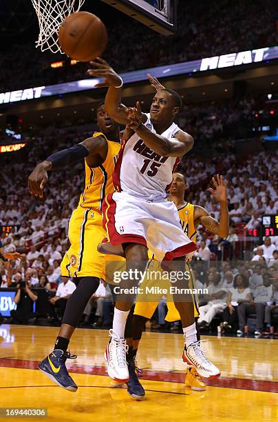 Mario Chalmers of the Miami Heat looks to pass against Ian Mahinmi of the Indiana Pacers in the first half during Game Two of the Eastern Conference...