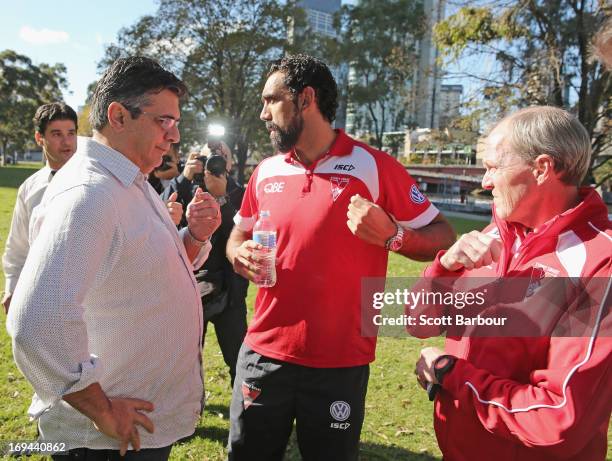 Adam Goodes of the Sydney Swans speaks with AFL CEO Andrew Demetriou as Sydney Swans General Manager of Football, Dean Moore looks on after Goodes...