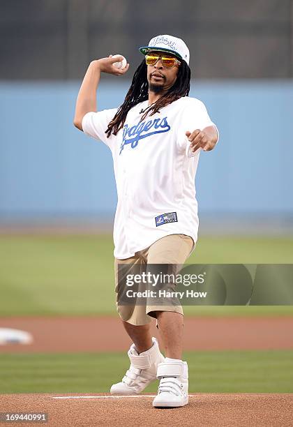 Rapper Lil Jon throws a ceremonial first pitch before the game between the St. Louis Cardinals and the Los Angeles Dodgers at Dodger Stadium on May...