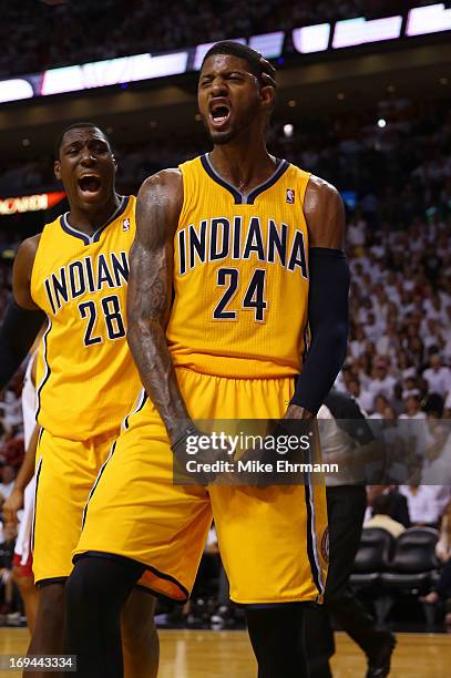 Paul George of the Indiana Pacers celebrates with Ian Mahinmi after a dunk in the second half against the Miami Heat during Game Two of the Eastern...