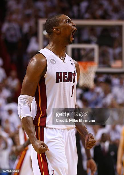 Chris Bosh of the Miami Heat reacts after a play in the second half against the Indiana Pacers during Game Two of the Eastern Conference Finals at...