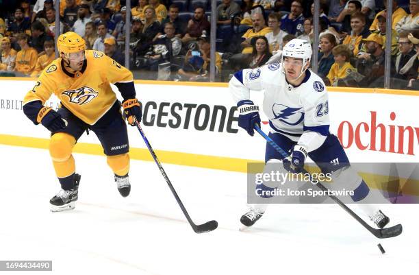 Nashville Predators defenseman Luke Schenn defends against Tampa forward Mikey Eyssimont during the NHL preseason game between the Nashville...