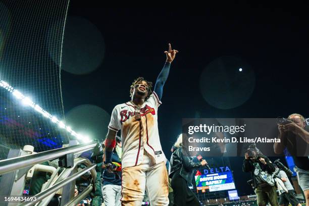 Ronald Acuna Jr. #13 of the Atlanta Braves waves to the crowd after a 6-5 win against the Chicago Cubs 6-5 in which he recorded his 70th steal of the...