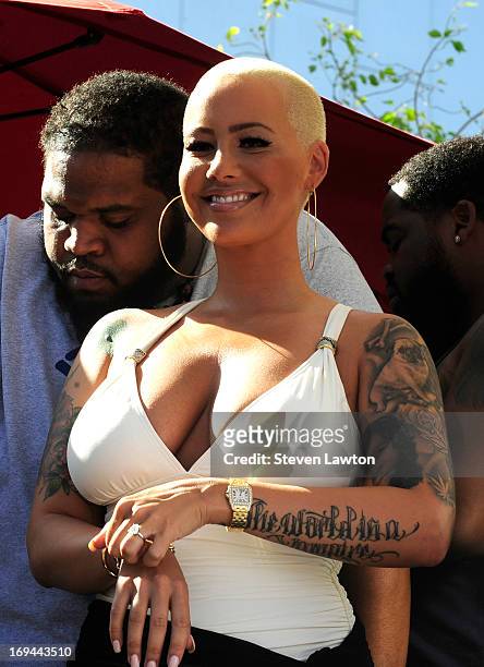 Model Amber Rose watches Wiz Khalifa performance at Ditch Fridays on Memorial Day weekend at the Palms Casino Resort on May 24, 2013 in Las Vegas,...