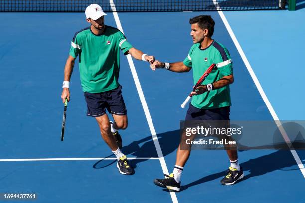 Andres Molteni and Maximo Gonzalez of Argentina return a shot in their match against Alexander Erler and Lucas Miedler of Austria during day 3 of the...