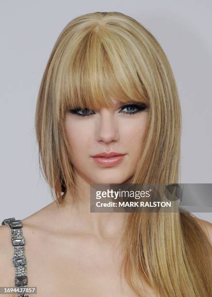 Musician Taylor Swift arrives on the red carpet of the 2010 American Music Awards at the Nokia Theatre in Los Angeles on November 21, 2010. AFP...
