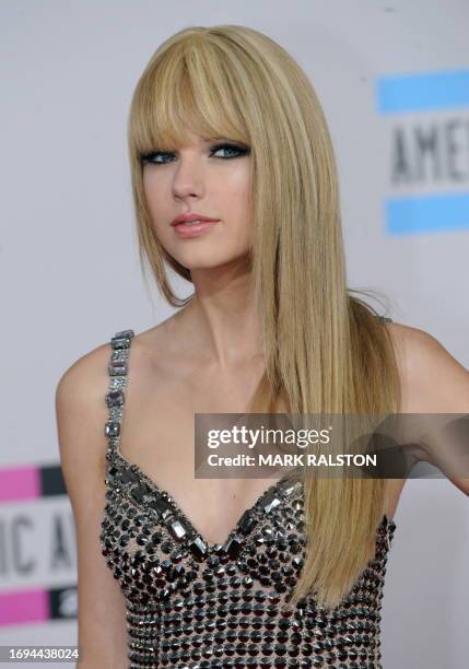 Musician Taylor Swift arrives on the red carpet of the 2010 American Music Awards at the Nokia Theatre in Los Angeles on November 21, 2010. AFP...