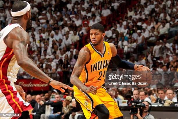 Paul George of the Indiana Pacers controls the ball against LeBron James of the Miami Heat in Game Two of the Eastern Conference Finals during the...