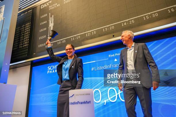Almuth Steinkuhler, chief financial officer of Schott Pharma AG, rings the ceremonial opening bell with Andreas Reisse, chief executive officer of...
