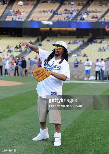 Rapper Lil Jon warms up before throwing out the ceremonial first pitch before the game between the St. Louis Cardinals and the Los Angeles Dodgers at...