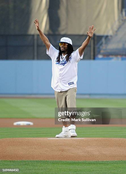 Rapper Lil Jon throws out the ceremonial first pitch before the game between the St. Louis Cardinals and the Los Angeles Dodgers at Dodger Stadium on...