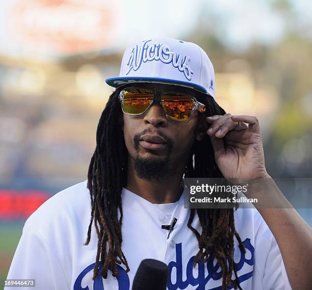 Rapper Lil Jon on the field before reading the Dodger starting lineup for the game between the St. Louis Cardinals and the Los Angeles Dodgers at...