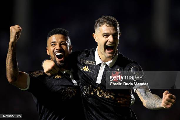 Vegetti of Vasco celebrates with Paulinho of Vasco after scoring the third goal of their team during the match between Vasco Da Gama and Coritiba as...