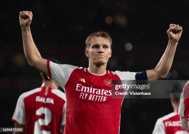 Martin Odegaard of Arsenal celebrates scoring during the UEFA Champions League match between Arsenal FC and PSV Eindhoven at Emirates Stadium on...