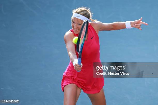 Victoria Azarenka of Belarus plays a backhand during the women's singles quarterfinal match against Caroline Garcia of France as part of the day...