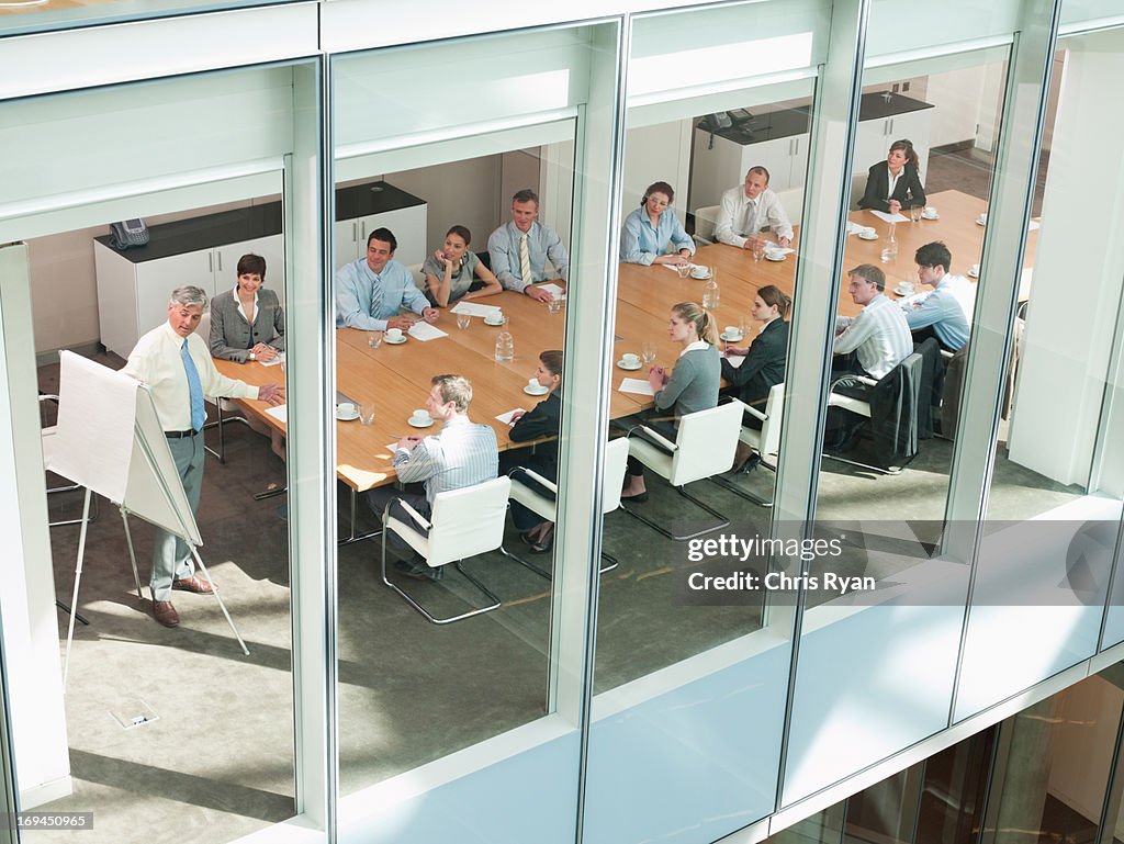 View of business people in conference room of highrise building