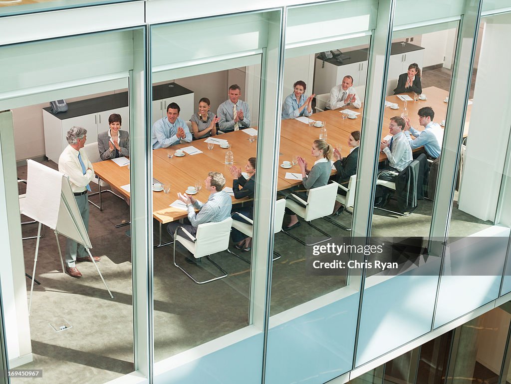 View of business people in conference room of highrise building