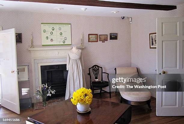 Chawton, England, April 2013 -- The sitting room in Jane Austen’s House Museum in Chawton features a morning dress on a mannequin.