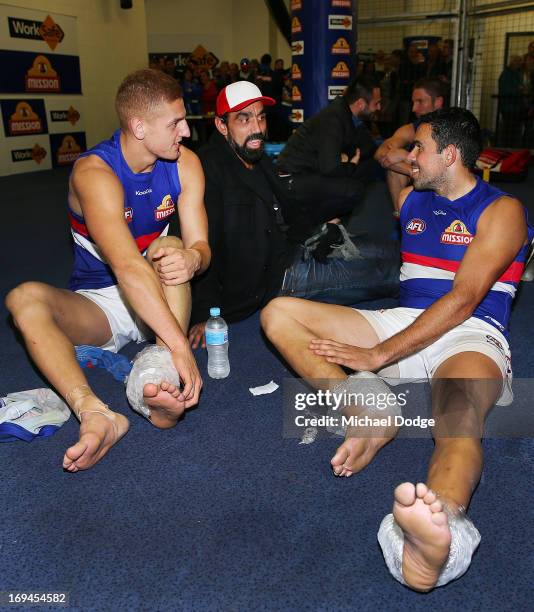 Adam Goodes of the Swans talks with brother Brett Goodes of the Bulldogs after his win during the round nine AFL match between the St Kilda Saints...