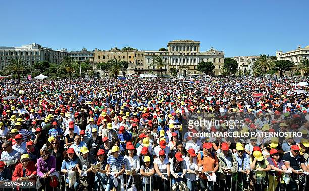Faithfuls attend at the beatification ceremony of Father Giuseppe "Pino" Puglisi, an outspoken anti-Mafia advocate, in Palermo on May 25,2013....
