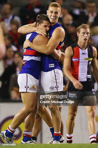 Clay Smith and Liam Jones of the Bulldogs celebrate a goal during the round nine AFL match between the St Kilda Saints and the Western Bulldogs at...