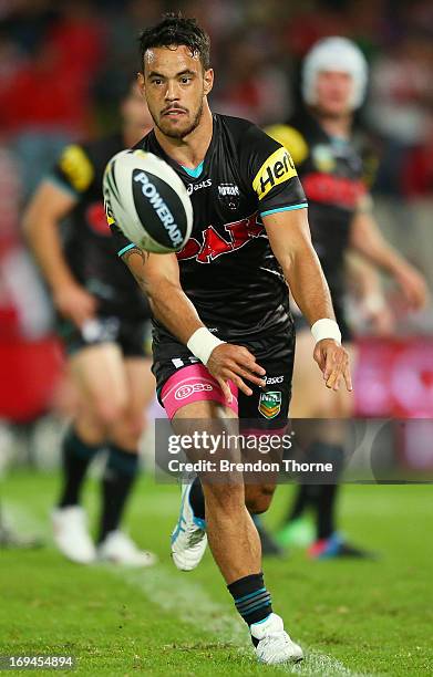 Isaac John of the Panthers passes the ball during the round 11 NRL match between the St George Ilawarra Dragons and the Penrith Panthers at WIN...