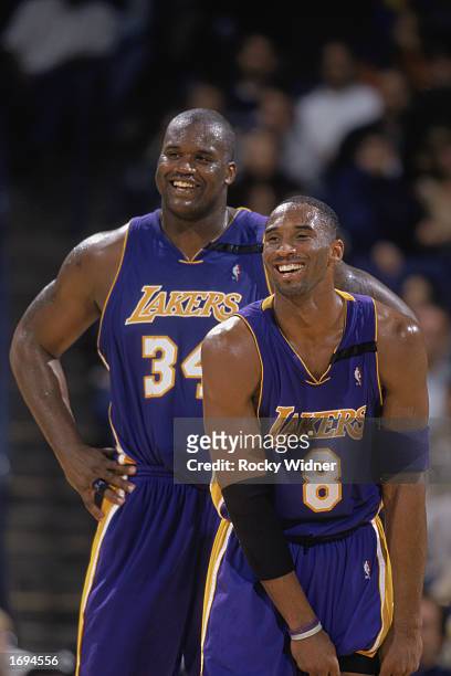 Shaquille O'Neal and Kobe Bryant of the Los Angeles Lakers smile during the NBA game against the Golden State Warriors at The Arena in Oakland on...