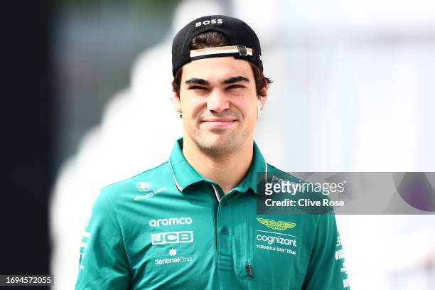 Lance Stroll of Canada and Aston Martin F1 Team walks in the Paddock prior to practice ahead of the F1 Grand Prix of Japan at Suzuka International...