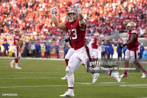 Christian McCaffrey of the San Francisco 49ers celebrates after scoring a touchdown against the New York Giants during the second quarter in the game...