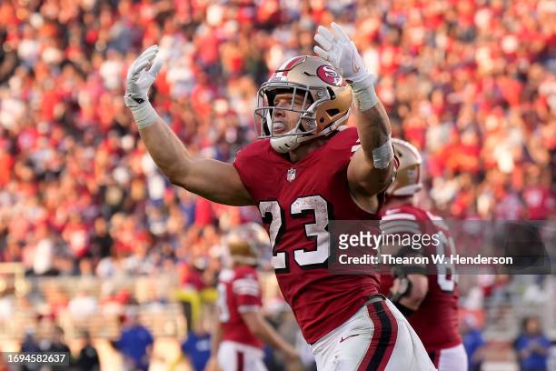 Christian McCaffrey of the San Francisco 49ers celebrates after scoring a touchdown against the New York Giants during the second quarter in the game...