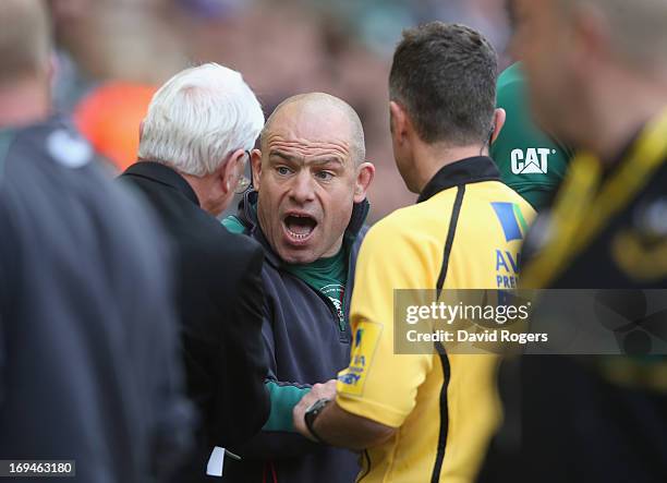 Richard Cockerill, the Leicester Tigers director of rugby argues with refereeing official Ed Morrison after a tackle by Courtney Lawes on Toby Flood...